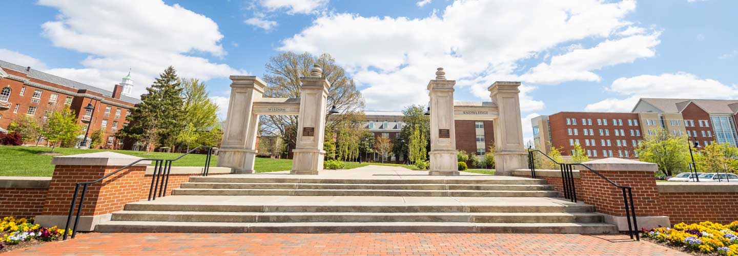 Main entrance to Eastern Kentucky University's campus in Richmond, KY. Large limestone columns flank a staircase.