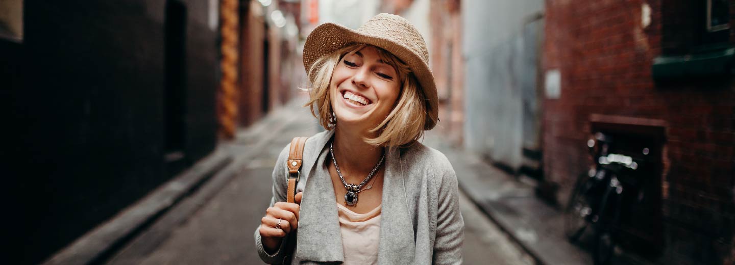 A young woman smiling.